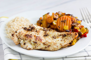   Grilled chicken breast with  vegetables and brown rice.
