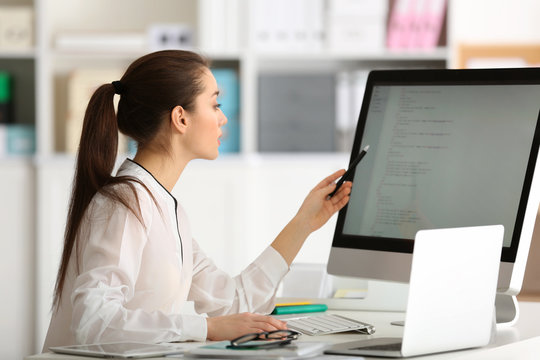 Young woman working at office
