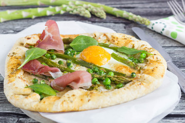 Uncut  galette with egg, asparagus, peas and ham.
