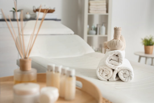 Towels with herbal bags in spa center