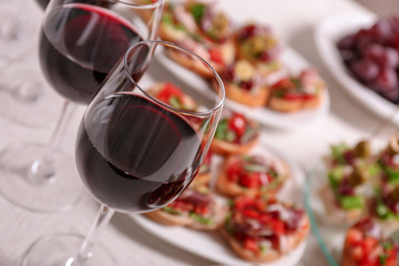 Wine with tasty bruschetta served on table