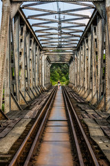 Fototapeta na wymiar bridge construction - old and rusty railway tracks and bridge