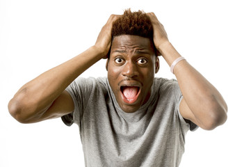 young attractive afro american man desperate in shock  with opened mouth worried