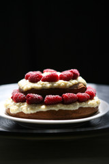 still life with a delicious cake with a custard and fresh raspberry	