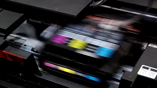 closeup CD disc printing with inkjet printer