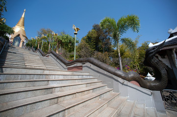 Staircase to Golden Pagoda in Wat Pa Phu Kon temple in Thailand.