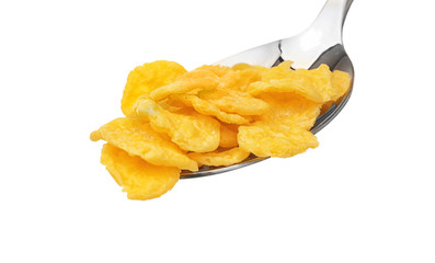Spoon with cornflakes isolated on white