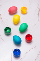 Naklejka na ściany i meble Easter eggs in beautiful nest on marble background.