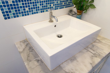 Fototapeta premium Bathroom interior with white sink and faucet.