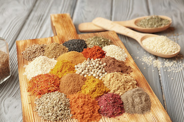 Different spices on wooden table