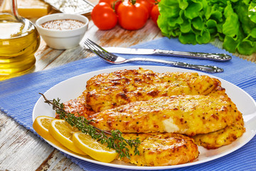 Baked Chicken breas on white plate
