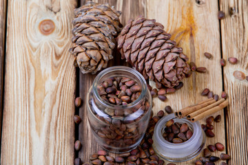 Cedar nuts and cones on wooden table