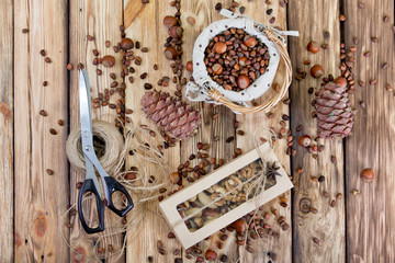 Nuts and pine cones on a wooden table