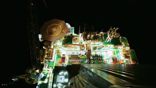 Oil production platform night top view