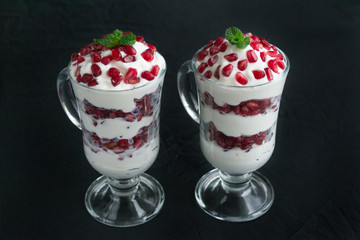 pomegranate dessert with cream and mint