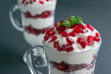 pomegranate dessert with cream and mint