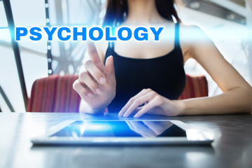 Woman is using tablet pc, pressing on virtual screen and selecting psychology.