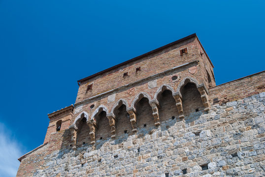 Medieval Italian balcony on the edge of the stone wall