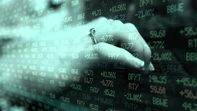 Wife typing on computer and worrying about her stocks