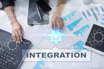 Woman is working with documents, tablet pc and notebook and selecting integration.