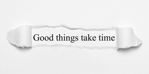 Good things take time on white torn paper