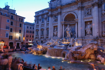 Fototapeta na wymiar Di Trevi fountain in Rome, Italy illuminated at dusk, shot at long exposure