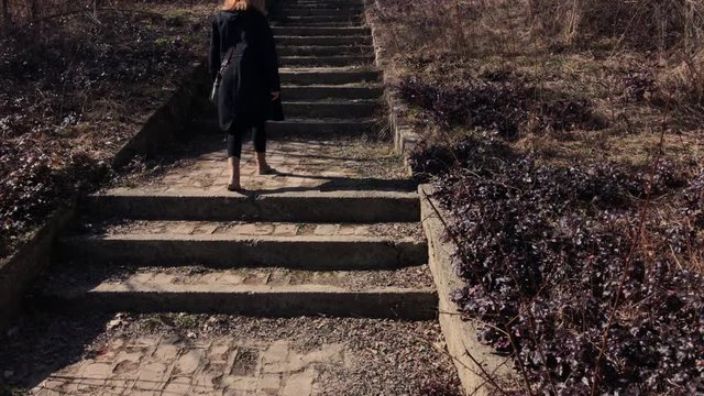 Younger woman on stairway in the forest 4K 2160p 30fps UltraHD footage - Female walking in the nature POV 3840X2160 UHD video 