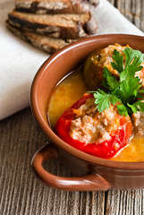 Plate with baked stuffed peppers