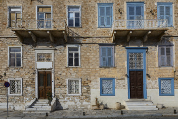 Facades of old buildings in Ermoupoli town on Syros island in Greece.