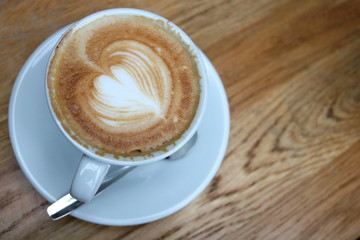 Coffee cup on wooden background 