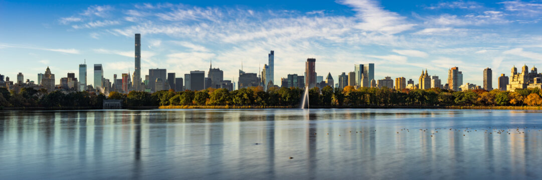 Morning panoramic view of the Central Park Reservoir and Midtown Manhattan skyscrapers in Fall. New York City
