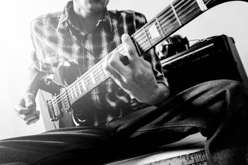 The man playing electric guitar, Black and white