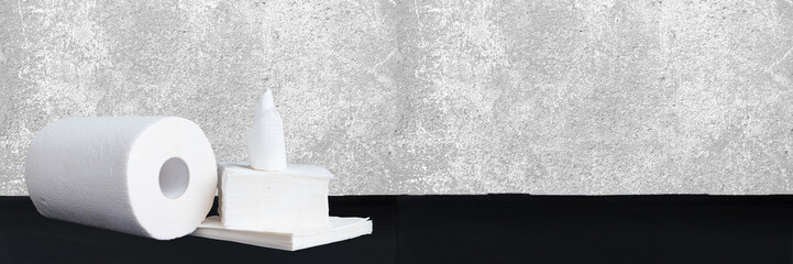 Paper tissue, paper towel and napkins on wooden background. Wide panoramic