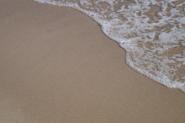 Soft wave of the ocean on the sandy beach