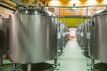 Modern Beer Factory. Rows of steel tanks for the storage beer.