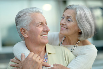 Happy elderly couple embracing