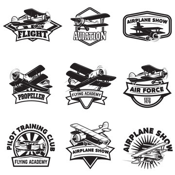 Set of flying academy emblems. Vintage airplanes. Design elements for logo, label, emblem, sign. Vector illustration.