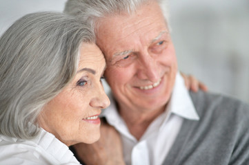 Happy elderly couple embracing