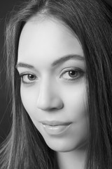 close-up portrait of girl with cocktail makeup on a black isolated background