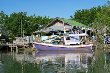 Fototapeta na wymiar Shack and a traditional fishermen’s sailing boat