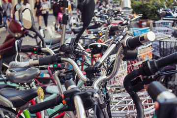 Obraz premium Public and private bicycles at bicycle parking spot; city of Shenzhen, People's republic of China
