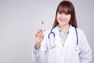 Healthy concept : Young Asian doctor with hypodermic syringe in hand