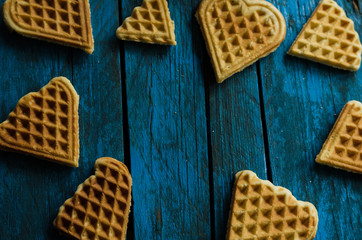 Home made heart shaped waffles on rustic table