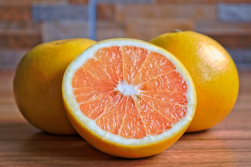 Closeup of grapefruits on a wooden table