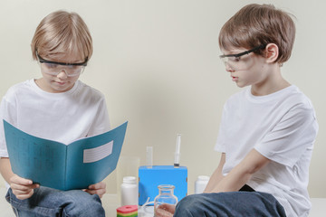 Kids preparing to make science experiments. Education concept.