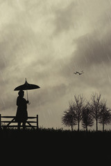 Silhouette Of Woman With Umbrella