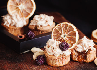 almond and orange cupcake with fresh blackberry
