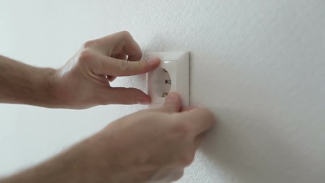 Electrician installing new current socket