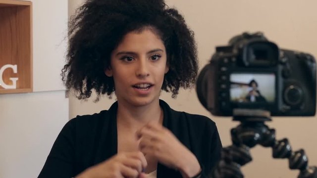 Influencer shooting video blog or vlog
