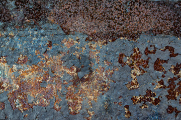 Texture of old rusty metal with remnants of paint